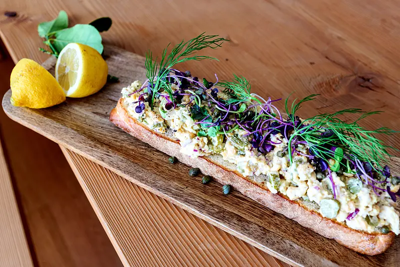 Egg salad crostini with chickpeas & umami kick